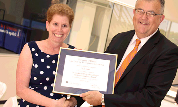 Jodi Flaws receives all-around excellence award from Dean Peter Constable