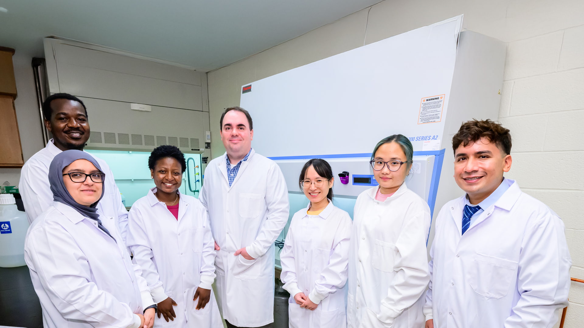 Gaulke Lab team standing together in lab