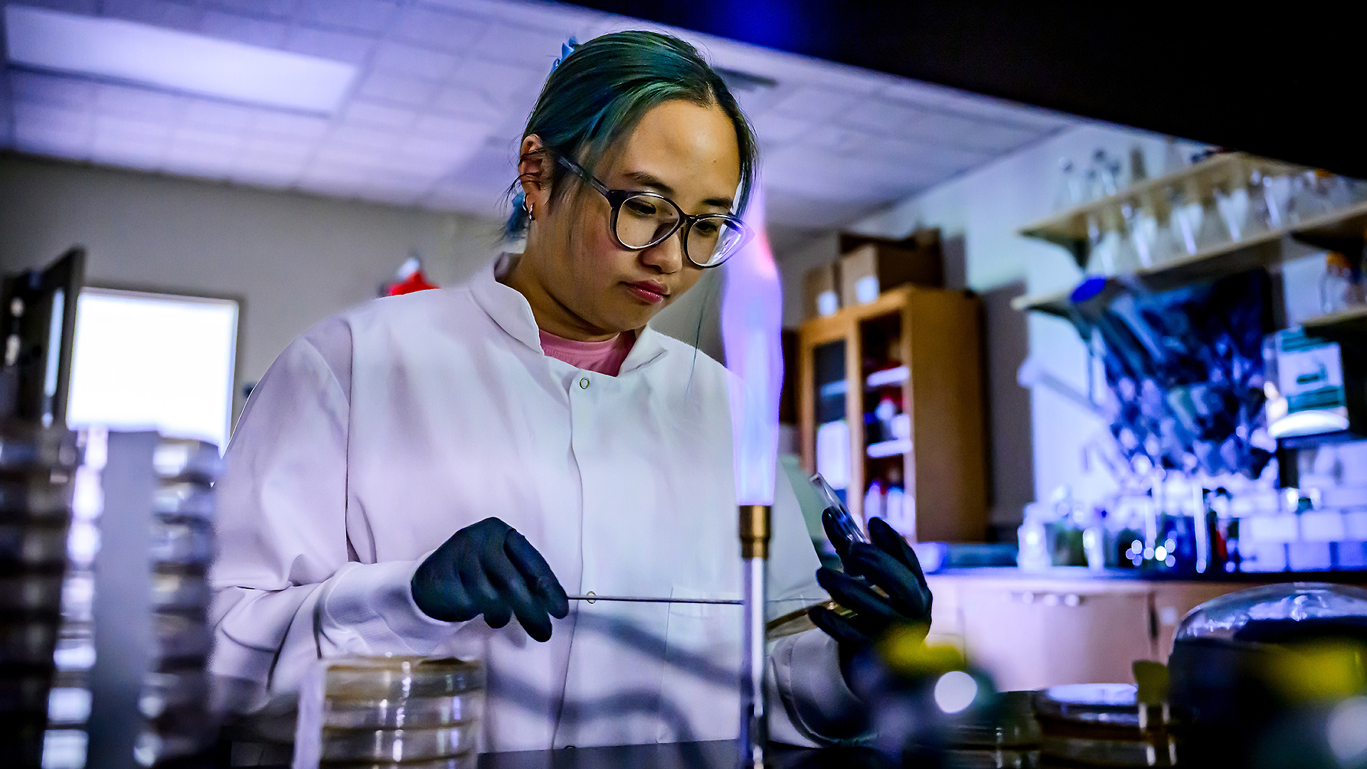 A student conducts microbiology research in the Gaulke Lab.