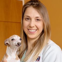 Stephanie Keating holding a small dog