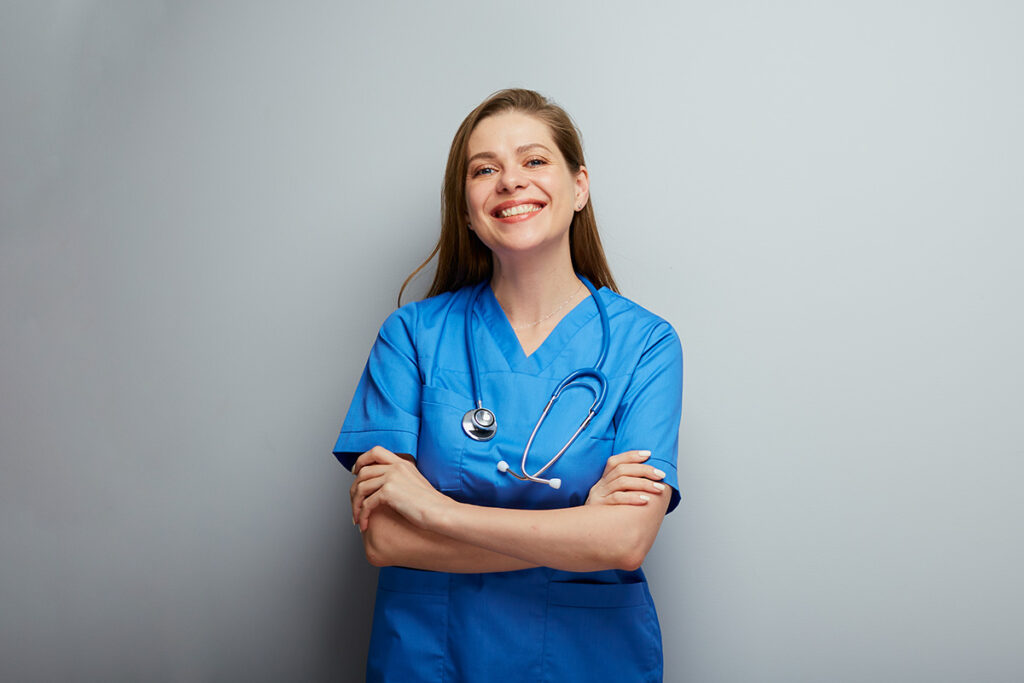 Woman wearing scrubs and a stethoscope