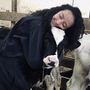 Cristina Gross hugging a calf