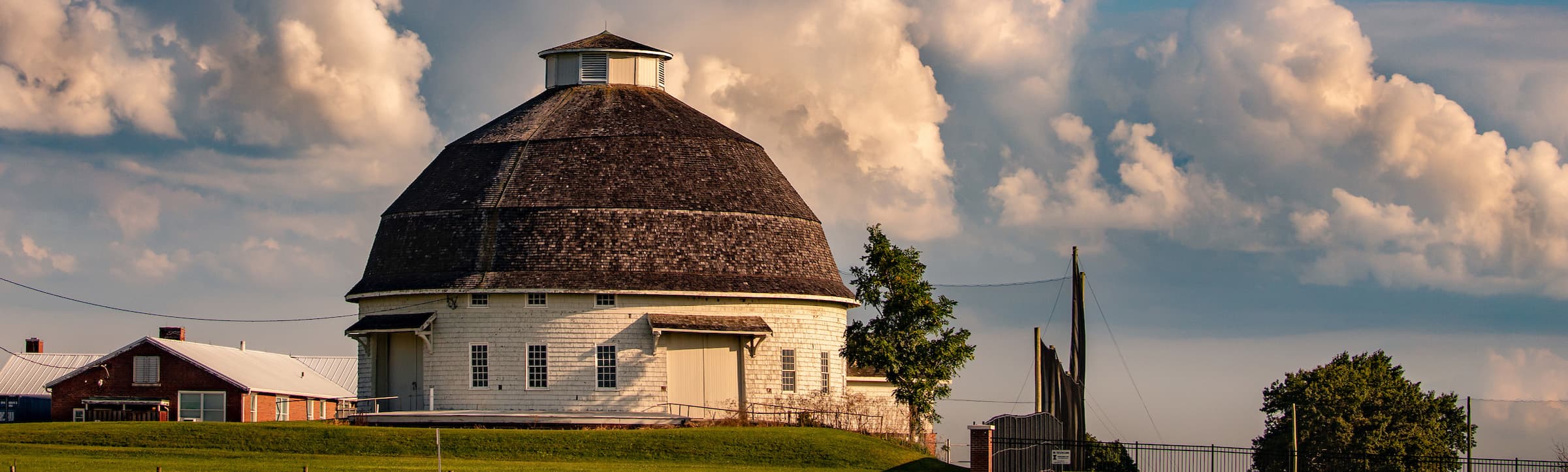 roundbarn in spring with cloudy sky