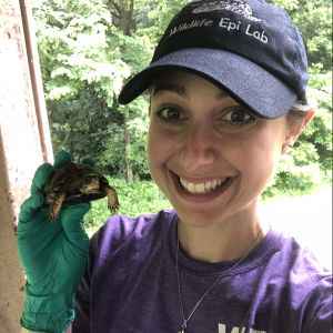 Emilie Ospina holds a box turtle.