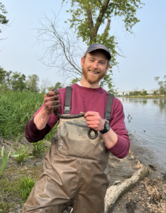 Dr. Winter holding a water snake