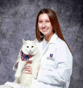 Student with her white cat