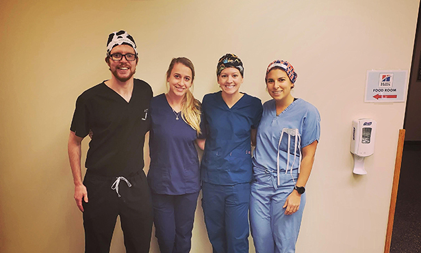 Students pose after third-year surgery