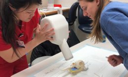 Student performing x-ray on educational skull