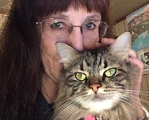 Elise holds Lucy the cat. 