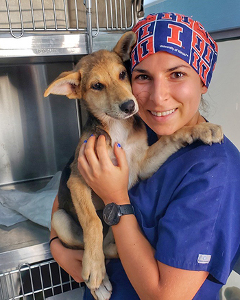 [Anita Kalonaros with dog at shelter in Greece]