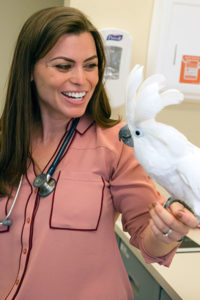 [Dr. Krista Keller with her bird]