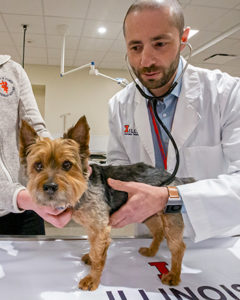 [Dr. Gene Pavlovsky with a patient]