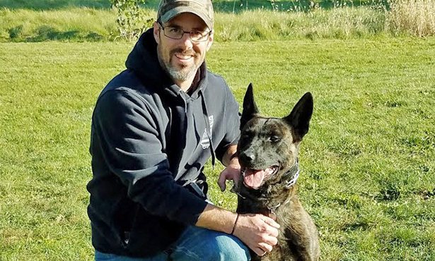 [Deputy Chad Beasley and his partner Arco]