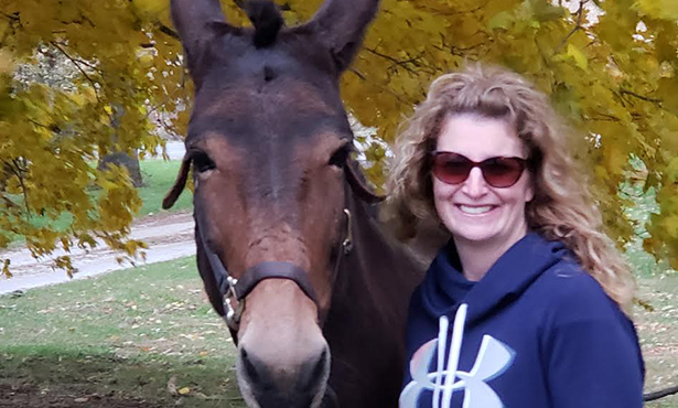 Sara Roy poses with a horse