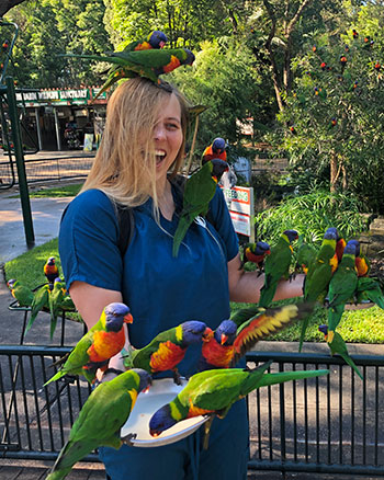 [Kara Hiebert and parrots]