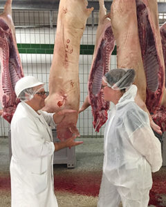 [Robin Holland-right-in a German slaughterhouse]