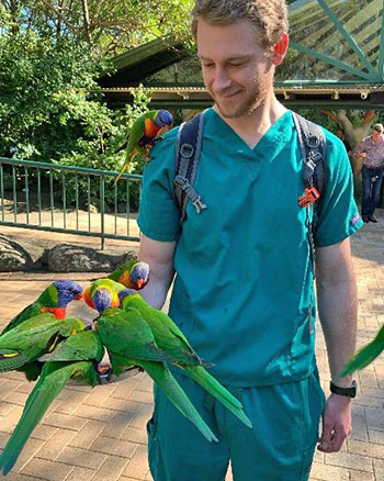 [John Winter with parrots]