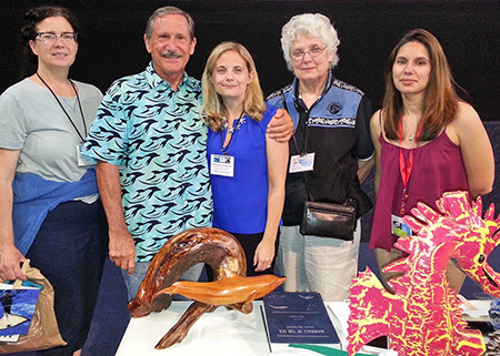 [kathleen colegrove (center) with IAAAM leaders]