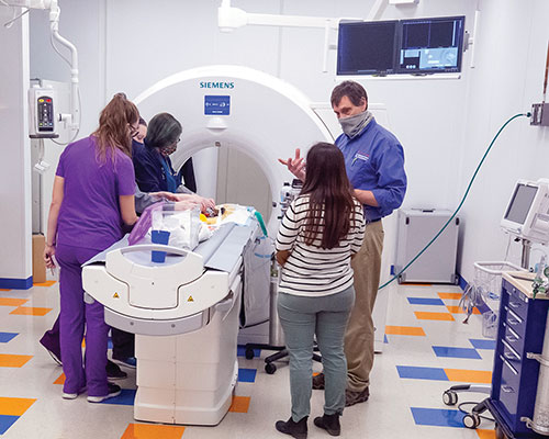 Dr. Kenneth Welle directs the imaging of one of his patients in the 128-slice