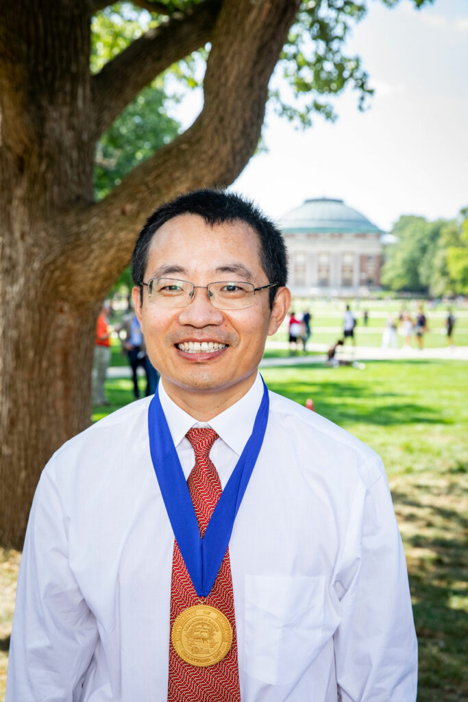 [Dr. Leyi Wang with Presidential Medallion]