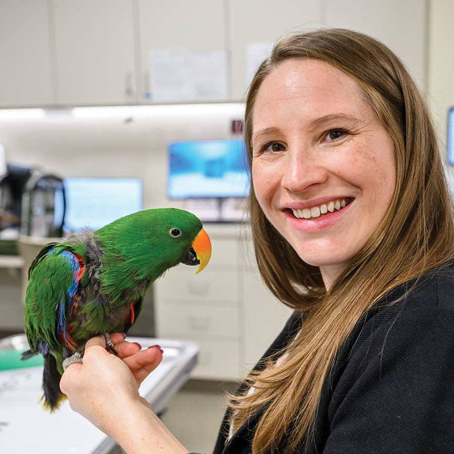 Michelle Borsdorf holding a parrot
