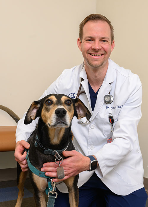 Dr. Canaan Shores with a dog