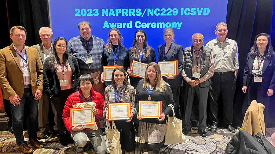 Conference organizers and student presentation award winners at the 2023 PRRS Conference