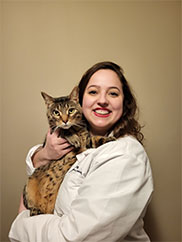 Dr. Lindenfield poses with a pet cat.