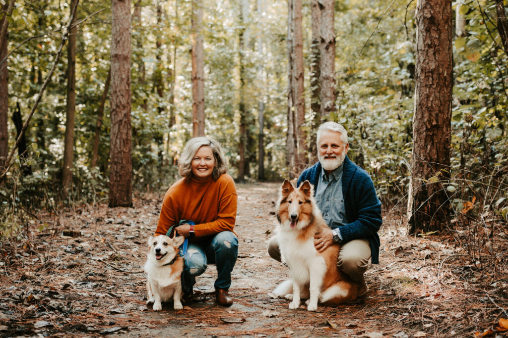 Ginger Passalacqua and her husband, Brad, pose with their two dogs.