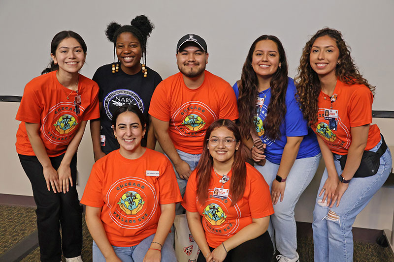 Dr. Ana Valbuena poses with current veterinary students who answered questions from high school students