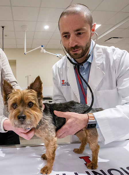 Dr. Gene Pavlovsky examining a dog