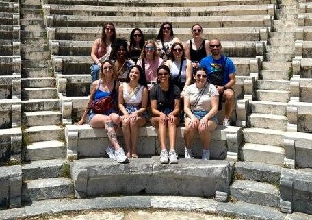 A group of University of Illinois veterinary students posing for a group photo in Greece.