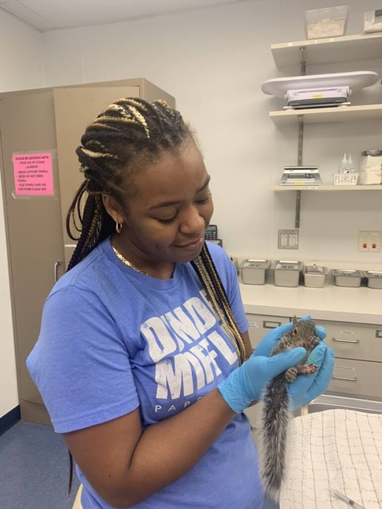 Dorothy Echols holding a squirrel.