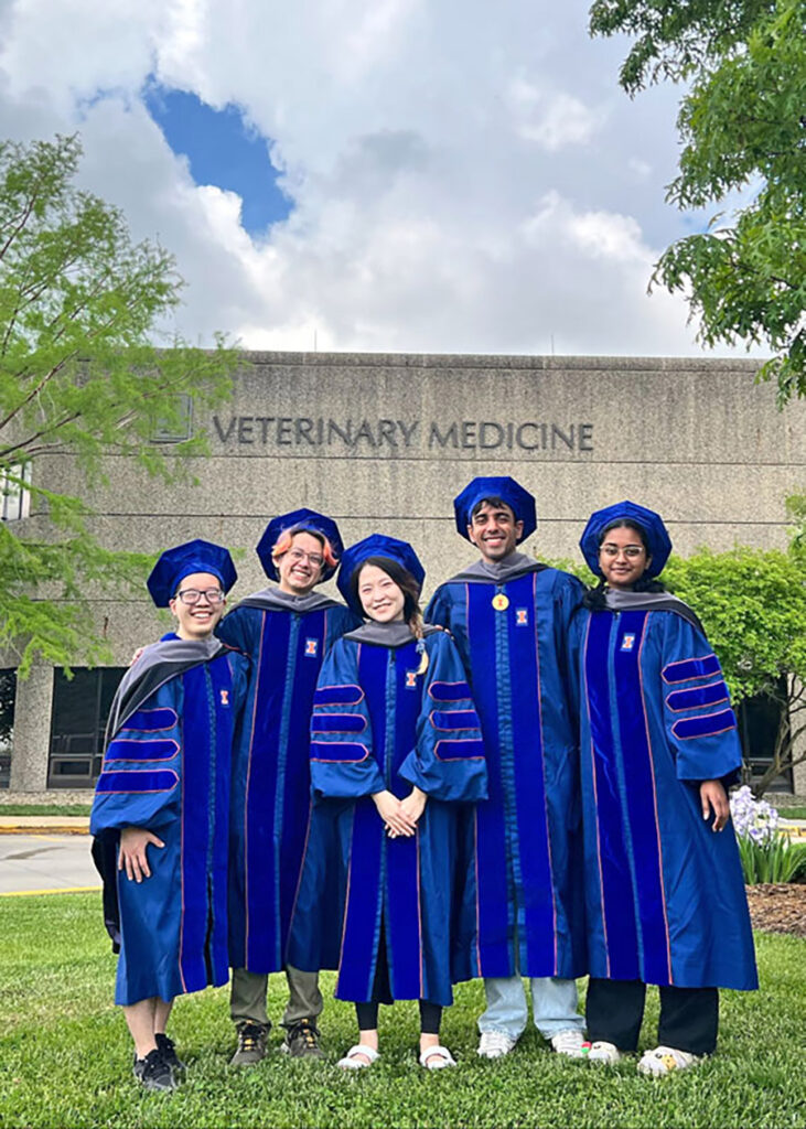 Varun Seth posing for a photo with other University of Illinois College of Veterinary Medicine graduates.