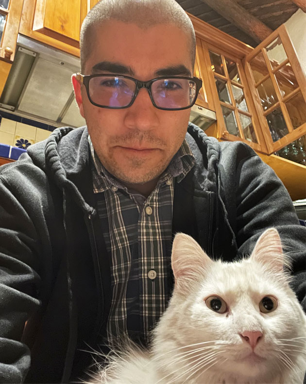 Alvaro Martinez with white cat