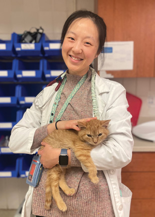 Dr. Monica Chen holding a cat