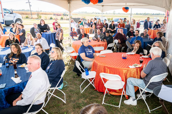 people in a tent during the Dr. John Coyne South Clinic ribbon cutting
