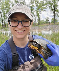 Dr. Laura Adamovicz with a turtle