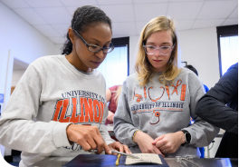 student and mentor in the clinical skills learning center, practicing suturing