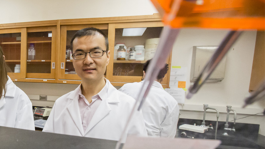 Dr. Joe (Huanyu) Qiao in his laboratory